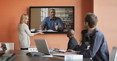 A person giving a video call to a group of people