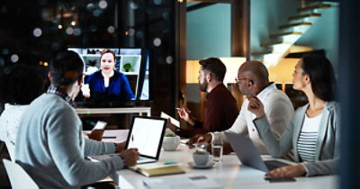 A group of people sitting around a table
