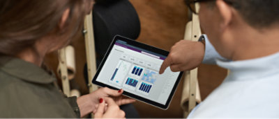 A woman sitting at a desk with Laptop.
