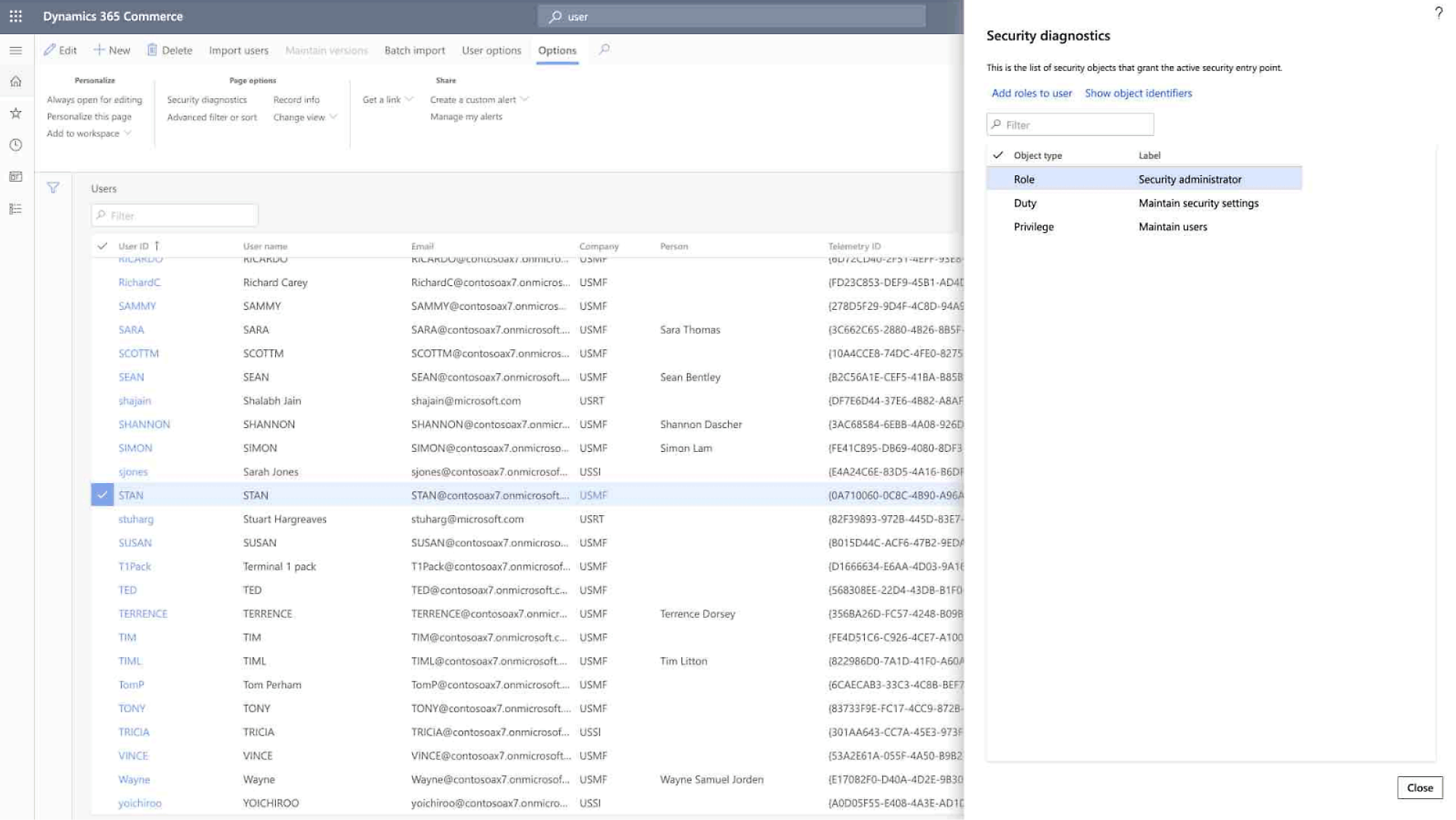 Screenshot of Dynamics 365 Commerce user management, showing users, email addresses, roles, and security settings