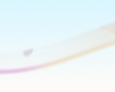 Soft gradient background with smooth wavy layers transitioning from blue to pink.