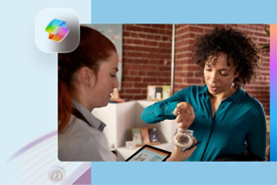 Two people holding a jar of chocolate samples