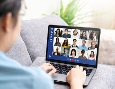 A woman using a laptop.
