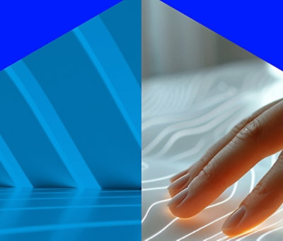 A close-up of a hand on a blue and white surface.