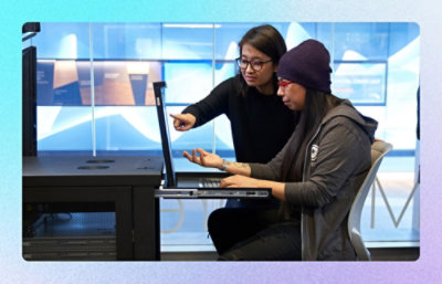 A person pointing at a laptop.