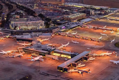 An aerial view of an airport at night.