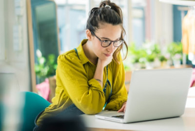 A woman working on laptop
