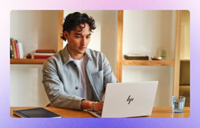  A man working on laptop diligently.