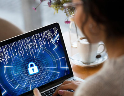 A woman using a laptop.