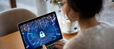 A woman using a laptop.