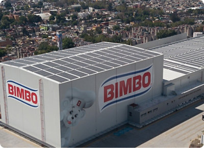 A large white building with red and blue BIMBO text on it.