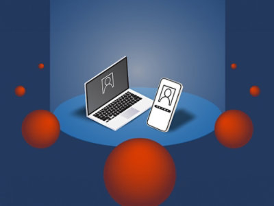 A laptop and phone on a blue surface.