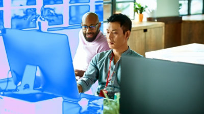 Two person looking at the computer screen