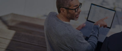 A man working on a laptop.