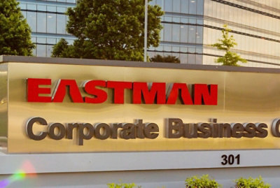 An image of Eastman corporate business name in front of its building