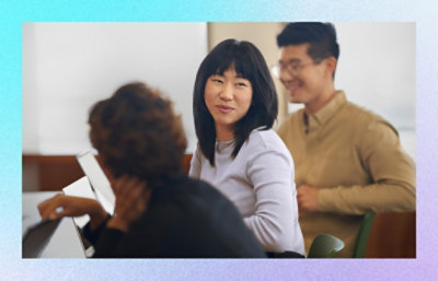 A group of employees happily working.
