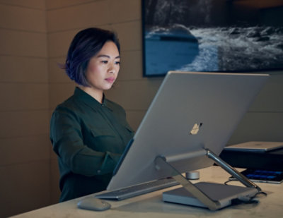 A woman looking at a computer screen.