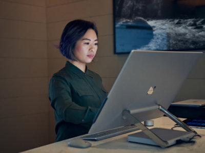 A woman looking at a computer screen.