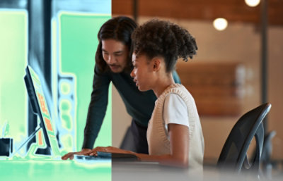 A women and a man looking into desktop screen.
