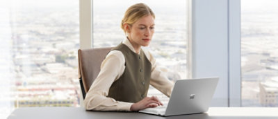 A women working with laptop in office.