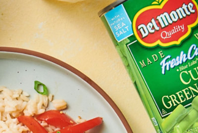 A close-up of a labeled package with text Natural Sea Salt and Del Monte Quality.