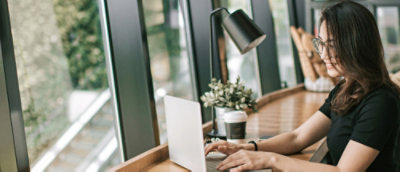 A women working on the laptop.