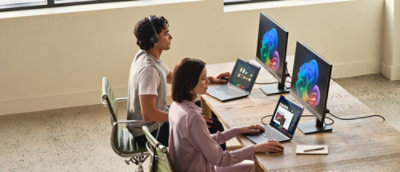 A group of people working on computers at desks.