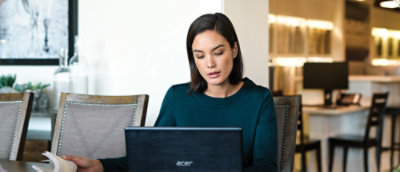 A women working on a laptop.