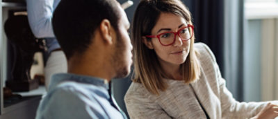A men and women looking at computer.