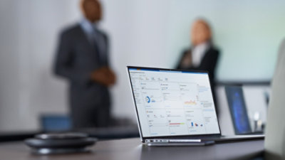 A man and a women talking to each other in office.
