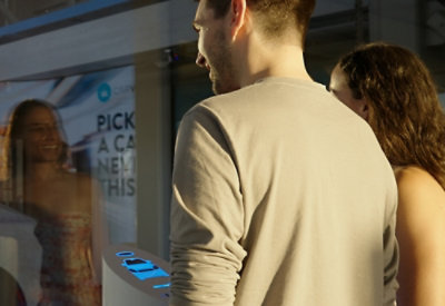 A man and woman standing together with text in the image partially visible.