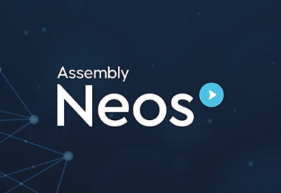 A close-up of a logo with the text Assembly Neos®.