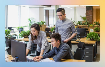 A group of people working on a computer.