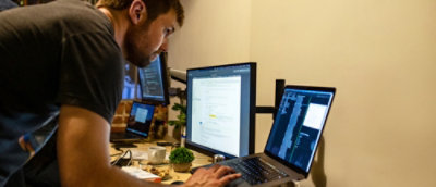 A person typing on a laptop.