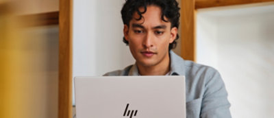 A man looking at a laptop.