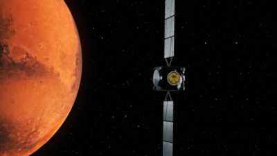 A satellite in space with a planet visible in the background.