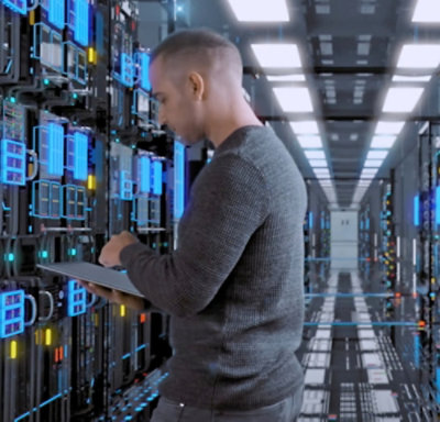 A man standing in a room with a tablet.