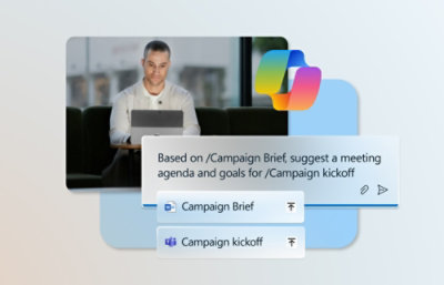 一位男士坐在桌前，面前放着一台笔记本电脑，屏幕上展示着市场活动启动议程。