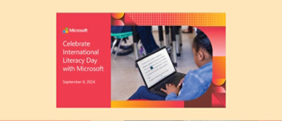 A girl sitting on the floor using a laptop.