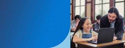 a man and woman looking at a laptop