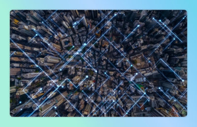 Aerial view of a city with buildings and streets visible.