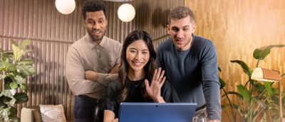 A group of people looking at a computer screen.