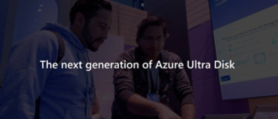 A group of people stands near a computer screen displaying text that reads The next generation of Azure Ultra Disk.