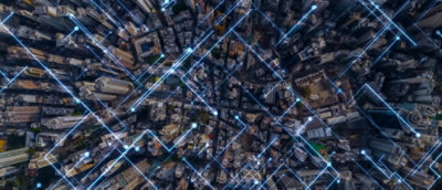 Aerial view of a city with lights visible.