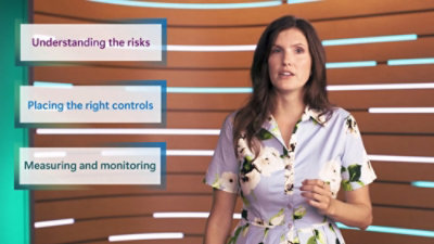 Individual explaining key concepts with supporting text panels in the background.