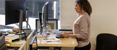 A woman looking at a computer screen.