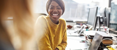 A woman looking at the camera and smiling