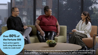 Three colleagues seated in a modern office discussion area, with overlay text highlighting Fortune 500 adoption of low-code AI agents.