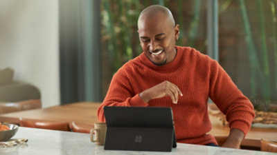 A man is looking at the laptop.