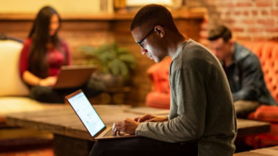 A man is working on a laptop.